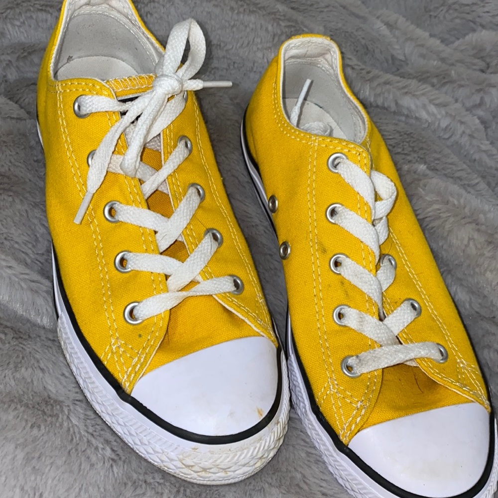 Yellow converse lightly worn